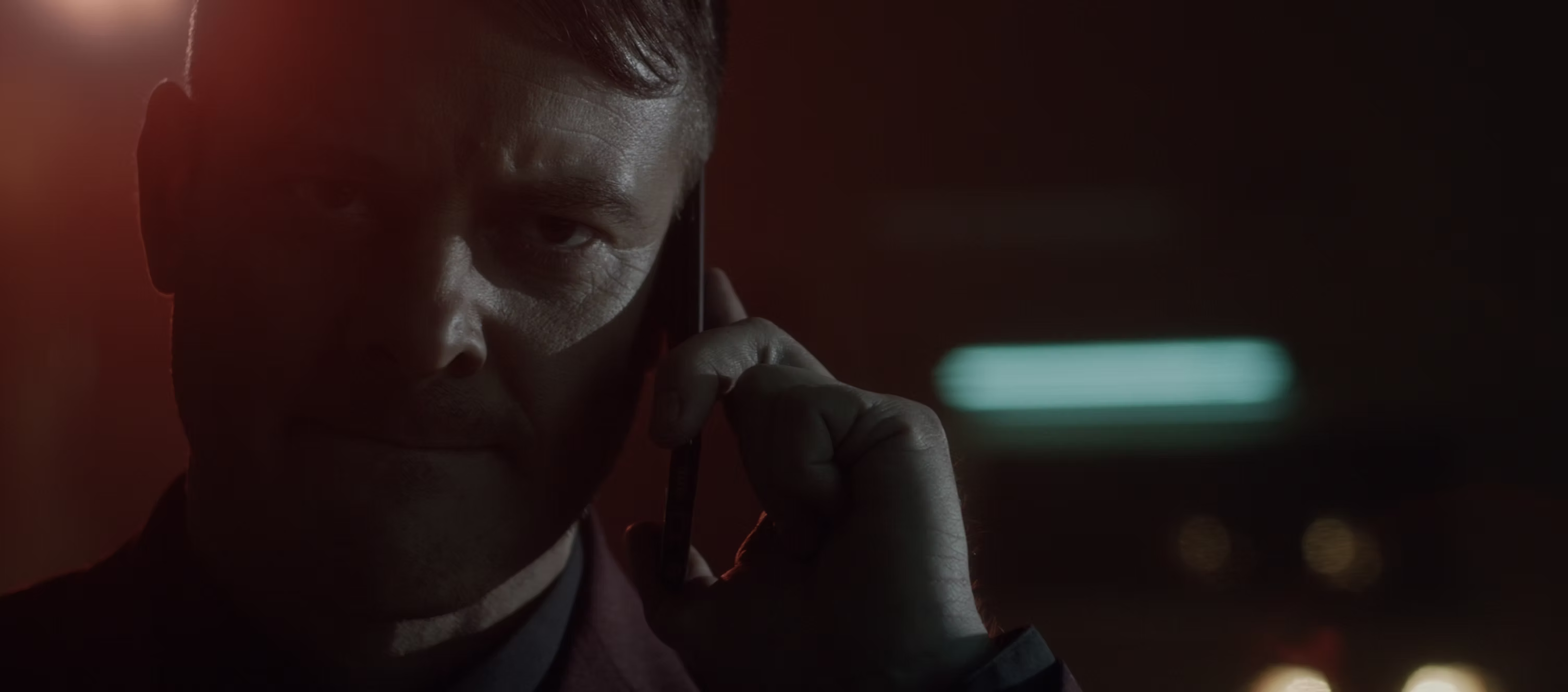 777 Raw Street slide featuring a man on the phone in red light