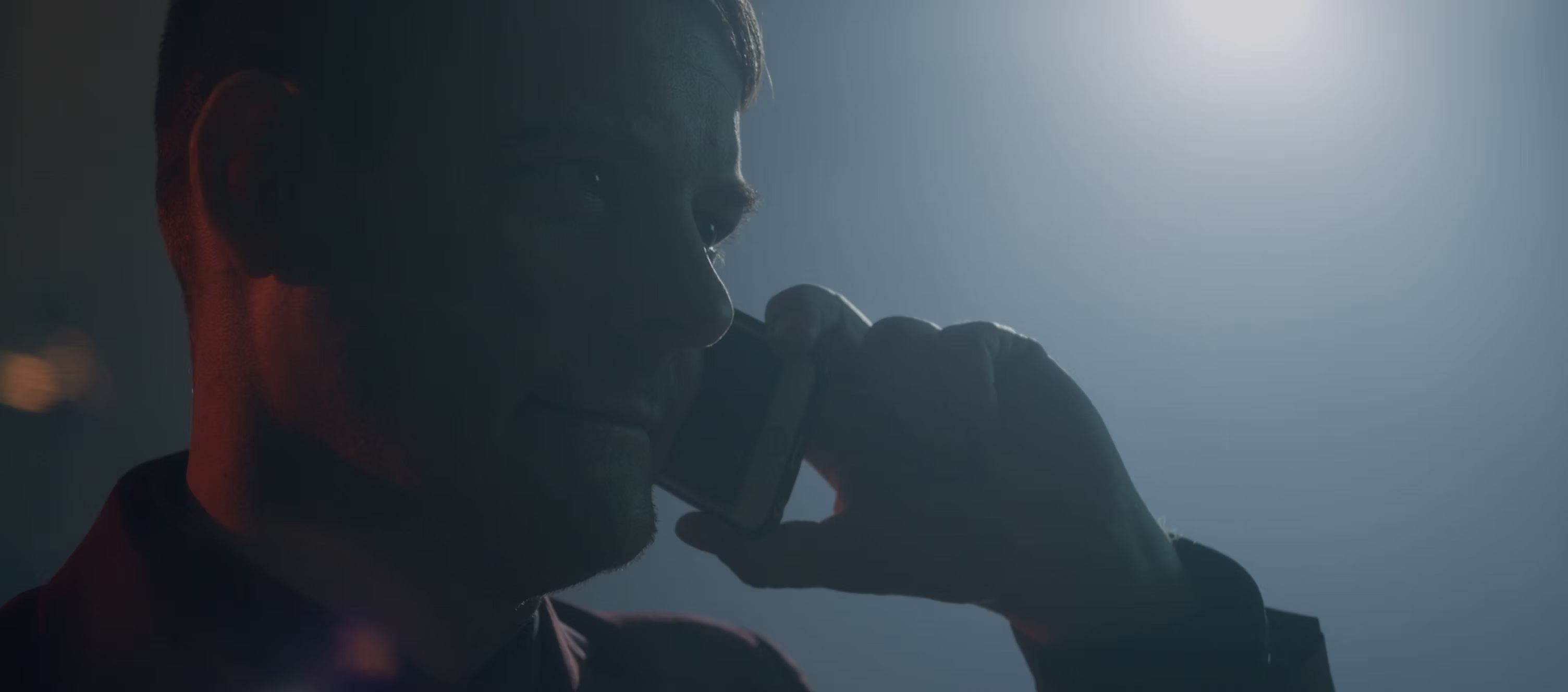 777 Raw Street slide featuring a man on the phone in blue light